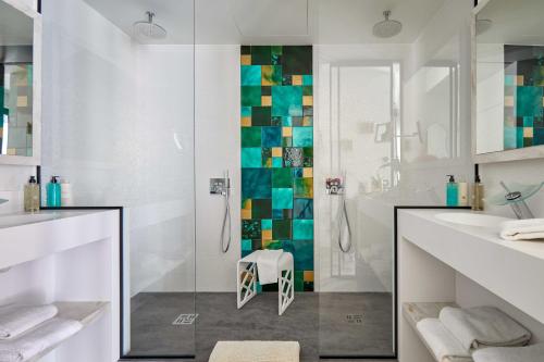 a bathroom with a shower and a sink at ABC Hotel in Blankenberge