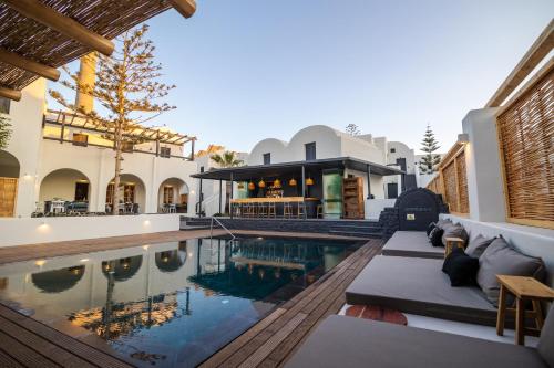 an exterior view of a house with a swimming pool at Scorpios Beach in Monolithos