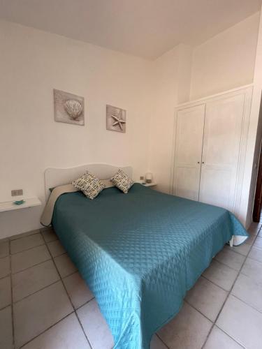 Costa Paradiso Apartment tesisinde bir odada yatak veya yataklar