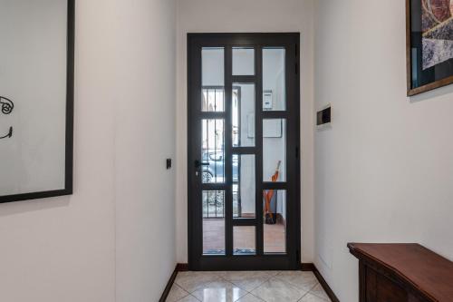 a door that is open in a room at Casa dei Renai by Rentbeat in Signa