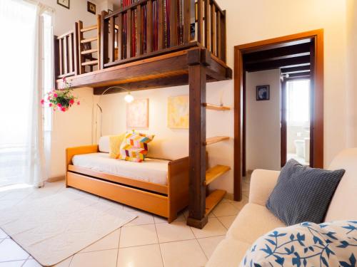 a room with a bunk bed and a staircase at Casa Maretta in Cagliari