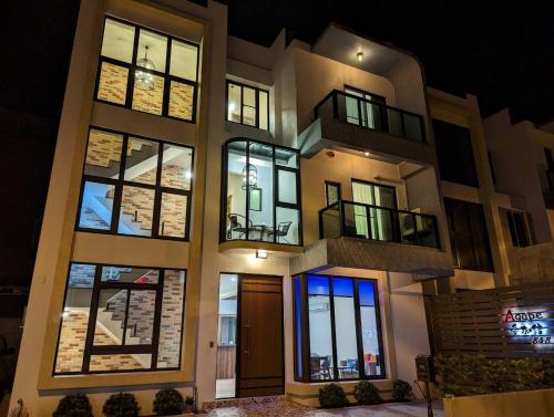 a building with a lit up facade at night at Agape Homestay in Magong