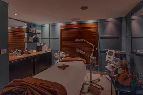 a hospital room with a bed and a sink at Radisson Blu Hotel, Cairo Heliopolis in Cairo