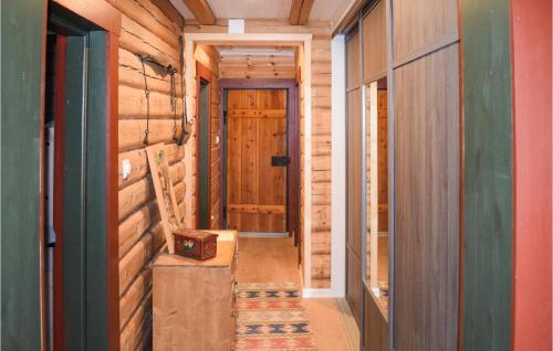 a hallway of a log cabin with a door at 3 Bedroom Lake Front Home In Sperrebotn in Sperrebotn