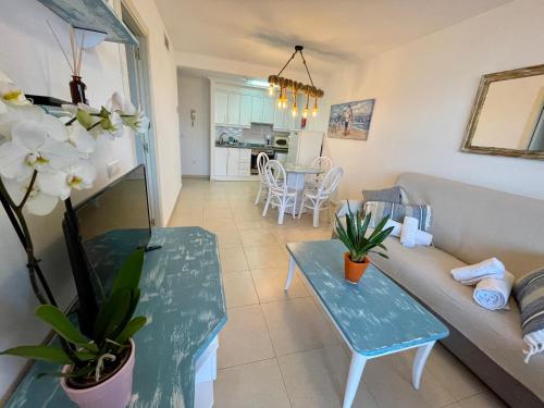 a living room with a couch and a table at Apto One More Day in Ambar in Calpe