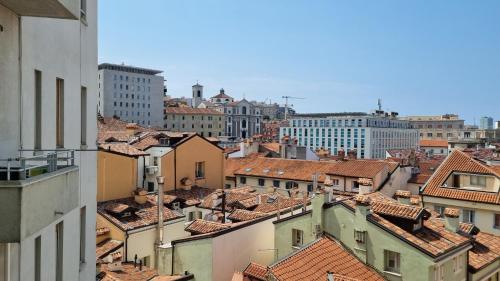 a view of a city with buildings and roofs at Locanda Al Volo Tor Bandena in Trieste