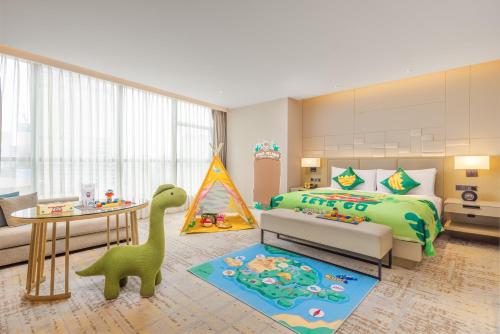 a childs bedroom with a dinosaur bed and a table at Chengdu Marriott Hotel Financial Centre in Chengdu