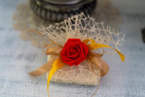 a red rose sitting on top of a table at B&B gigi in Benevento