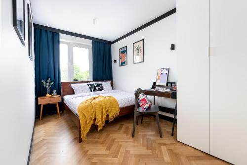 Una cama o camas en una habitación de Modernizmo by 3City Rentals