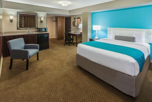 a large hotel room with a large bed and a desk at Hotel 505 in Albuquerque