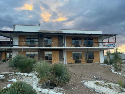 a large building with a balcony on a beach at Landmark Lookout Lodge in Tombstone