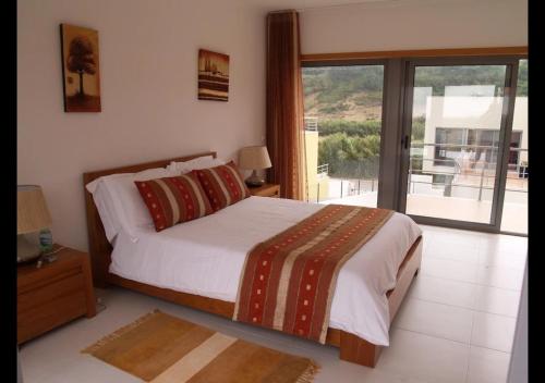 Ένα ή περισσότερα κρεβάτια σε δωμάτιο στο Foz Villa