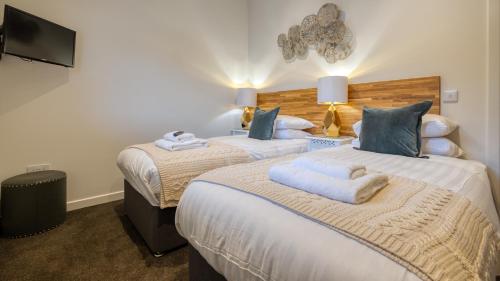 Una cama o camas en una habitación de Balloch Park