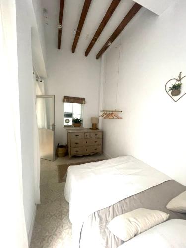 En eller flere senge i et værelse på El Patio Secreto