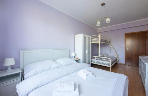 Ein Bett oder Betten in einem Zimmer der Unterkunft Apartmany Sileas