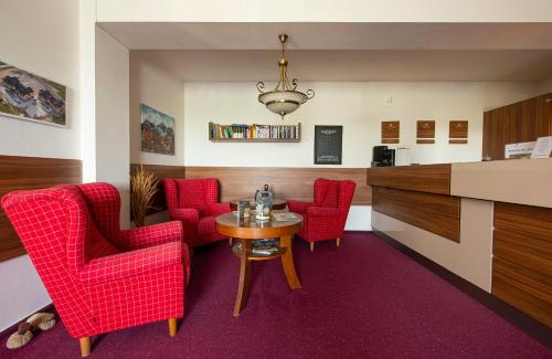 Ein Sitzbereich in der Unterkunft Apartmany Sileas