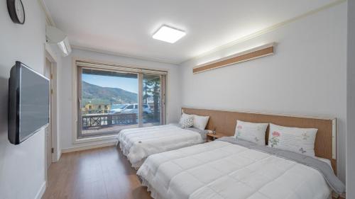 Ένα ή περισσότερα κρεβάτια σε δωμάτιο στο Maremonte Pension
