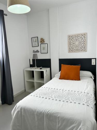 Postel nebo postele na pokoji v ubytování Hostal Berlin