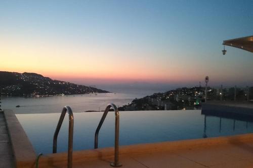 a swimming pool with a view of the ocean at MAGNIFICENT VIEW with Private Pool & Piano, 3 Bedroom Villa, MIN 4 nigths in Gundogan