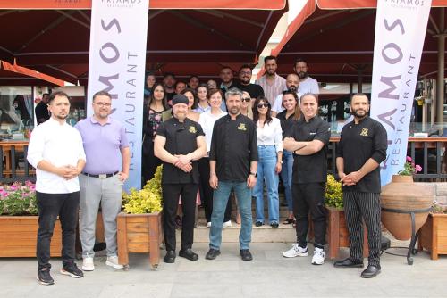 a group of people posing for a picture at Buyuk Truva Hotel in Canakkale