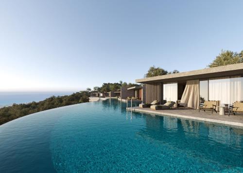 a swimming pool with a view of the ocean at King Jason Zante – Designed for Adults in Planos