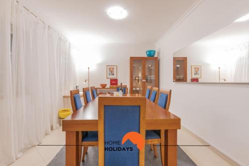 a dining room with a table and chairs at #056 Old Post Office by Home Holidays in Albufeira