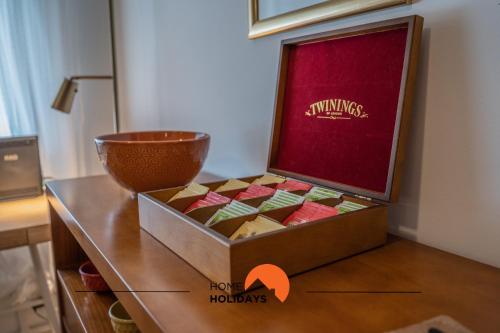 a box of chocolates sitting on top of a table at #056 Old Post Office by Home Holidays in Albufeira