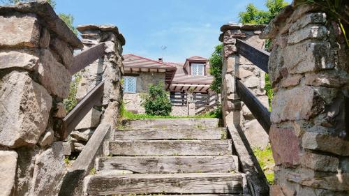 a set of stone stairs leading to a house at El huerto de la Reina in Becerril de la Sierra