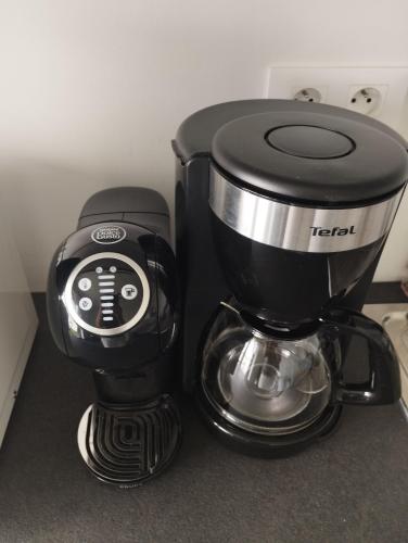 a coffee pot sitting on top of a counter at L'Altéia - L'appartement les pieds dans l'eau avec place de parking privé et accès direct à la plage in Berck-sur-Mer