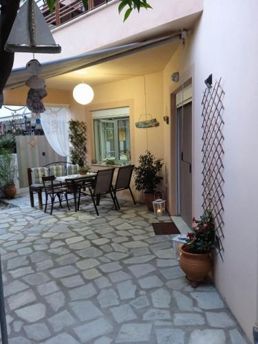 a patio with chairs and a table on a patio at Dream House in Agria