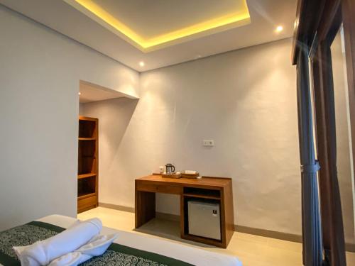 Postel nebo postele na pokoji v ubytování Kope House Ubud