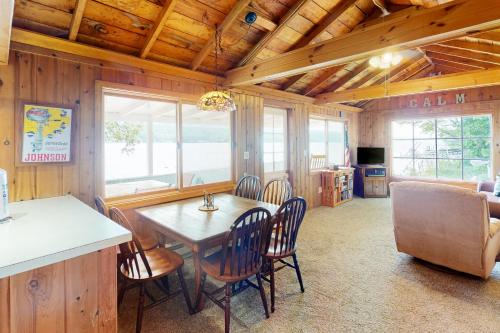 a kitchen and dining room with a table and chairs at Sweet Sunrise in Penn Yan