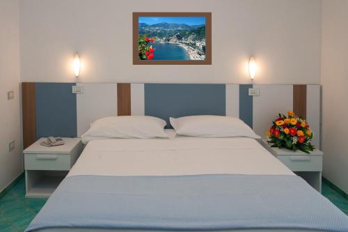 Postel nebo postele na pokoji v ubytování Hotel De Rosa