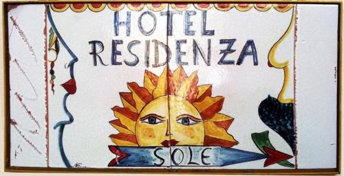 a sign for a hotelresidenosa with a sun at Residenza Sole Amalfi in Amalfi