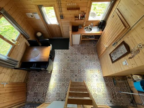an overhead view of a tiny house with a staircase at De Diepen in Milsbeek