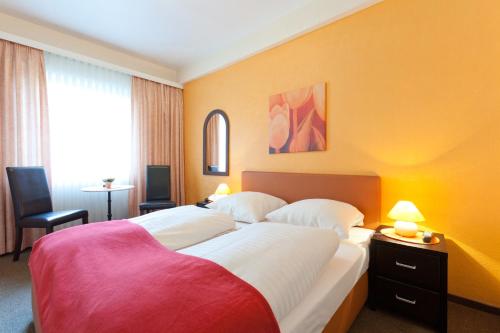 Letto o letti in una camera di Hotel Imperial