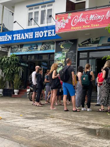 a group of people standing outside of a hotel at Thien Thanh Hotel in Phong Nha