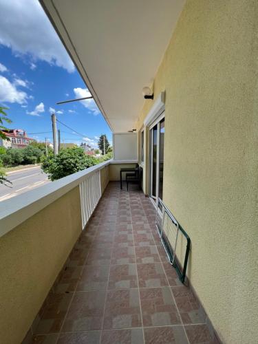 a balcony of a building with a view of a street at Apartments and pansion M&R in Turanj
