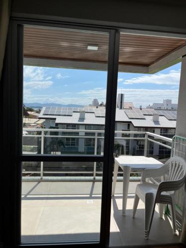 a view from a balcony with a table and chairs at Balmare Hotel in Florianópolis