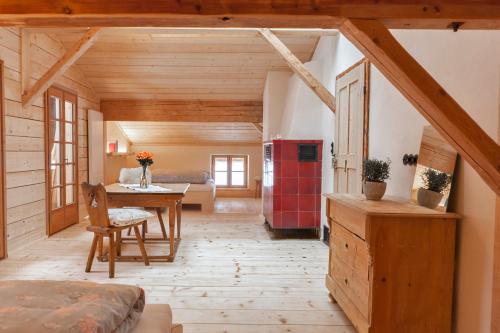a room with a kitchen and a dining room at Hasenalm in Schliersee