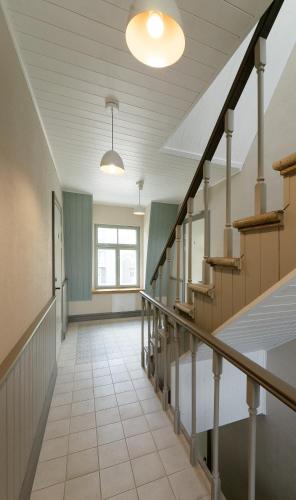 a hallway with stairs in a house at Verona Apartments - Paide in Paide