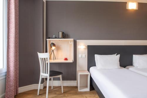 Кровать или кровати в номере Hôtel Baldi by Magna Arbor