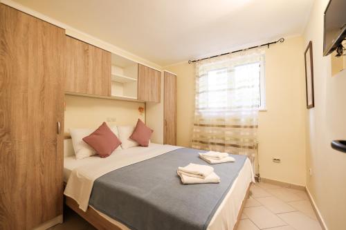 Postel nebo postele na pokoji v ubytování Rooms Malic