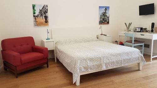 Postel nebo postele na pokoji v ubytování Il Cortile del Marchese Beccadelli