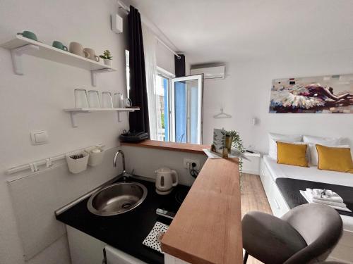 a small kitchen with a sink and a counter at Studio apartments RAFAEL - 4 minutes to the beach in Gradac