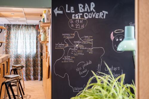a chalkboard wall in a restaurant with a bar sign at greet Chartres Est in Chartres