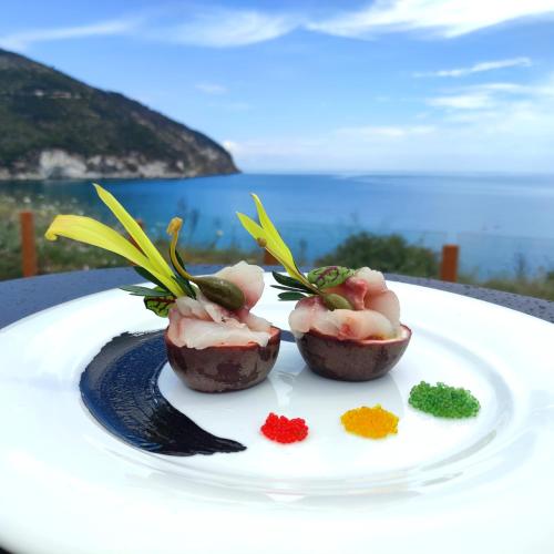 a plate of food on a table with some food on it at Le Lenze Don Mimì Glamping in Mattinata