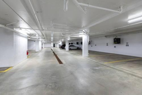 an empty parking garage with a car parked in it at Tremblant Prestige - Horizon 1-203 in Mont-Tremblant