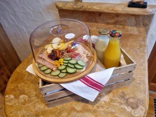 a bowl of food on a table with a plate of food at Ecologie Grundlsee in Grundlsee