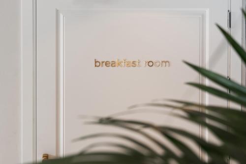 a door with the words breakfast room written on it at Parioli Hotel Rimini in Rimini